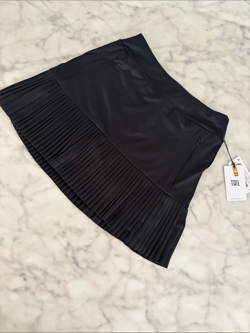TAIL Black Pleated Hem Mini Skirt. New with tags.  Size XS